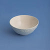 Price & Kensington Daisy Stoneware Cereal Bowl on blue background