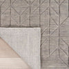 Neutral grey rug with subtle geometric pattern.