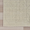 Neutral rug with carved geometric pattern