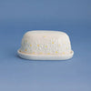 Price & Kensington Daisy Butter Dish on a blue background