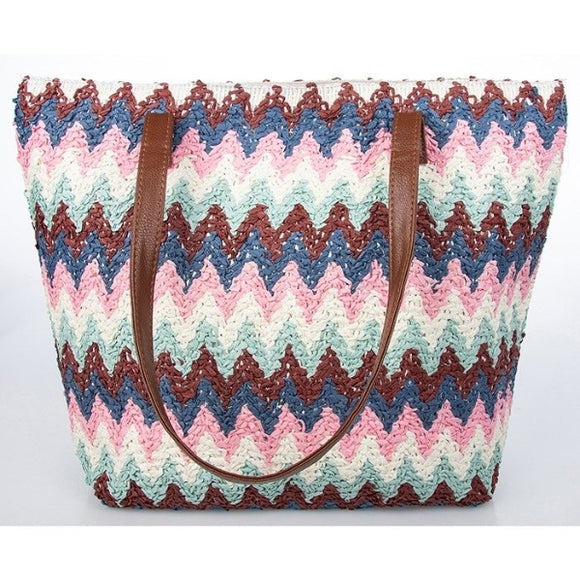 The Woven Zig Zag Tote Bag in White and Pink is a stylish and trendy accessory that combines fashion and functionality. The white and pink woven pattern creates a chic and eye-catching design, perfect for adding a pop of color to your outfit. With its spacious interior and sturdy construction, this tote bag is ideal for carrying your daily essentials in style. Whether you're going to the beach, running errands, or attending a casual outing, this tote bag is a fashionable and practical choice.