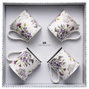 A visual representation of the "Newgrange White Thistle Mug Gift Set Of 4," highlighting the exquisite White Thistle design and craftsmanship. Perfect for adding sophistication to your tea or coffee moments or as a thoughtful gift.