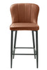 Luxurious kitchen stool featuring dark metal legs for sturdy support.