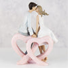 Figurine  Couple Sitting Kissing Single Heart