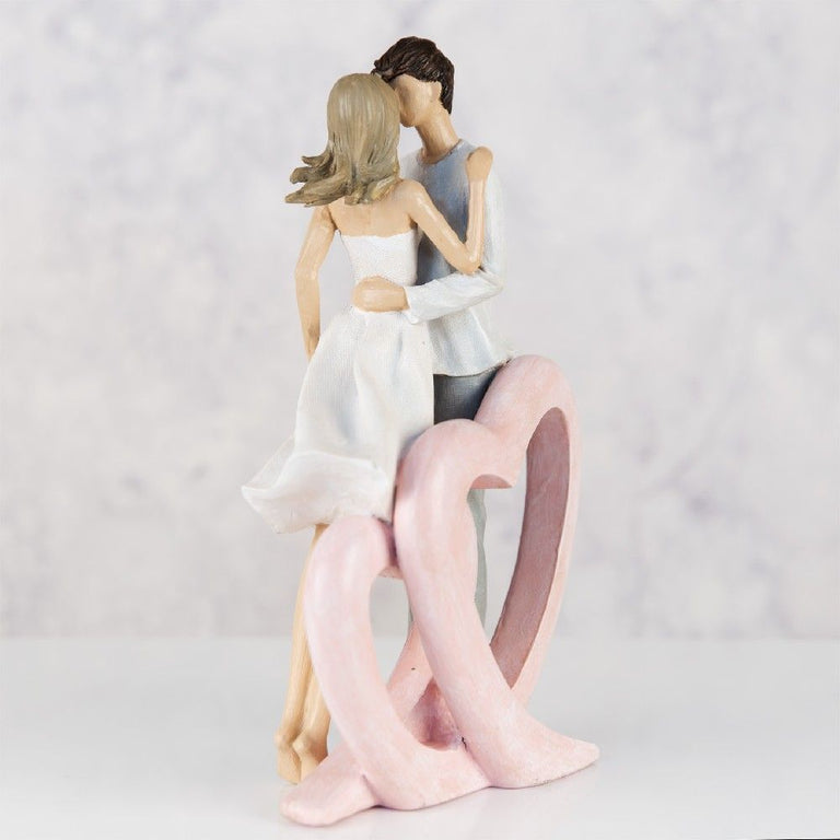 Figurine Couple Embracing Single Heart
