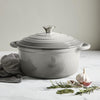 A visual representation of the Cast Iron Casserole Graduated Grey 26cm, showcasing its stylish graduated grey finish and secure-fitting lid for exceptional cooking.