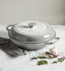 A visual representation of the Cast Iron Casserole Graduated Grey 26cm, showcasing its stylish graduated grey finish and secure-fitting lid for exceptional cooking.